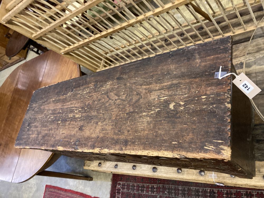 An elm and oak six plank coffer with lunette carved front, width 112cm depth 36cm height 58cm